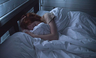 Woman sleeping in bed