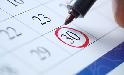 Close up of calendar with the 30th day circled in red