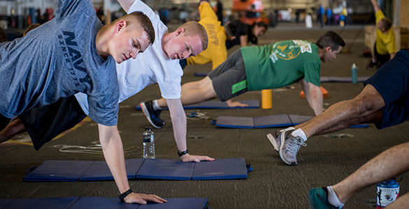 Service members working out together