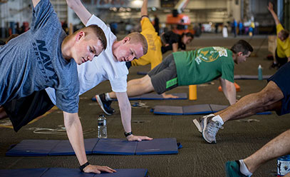 Service members doing running workouts together