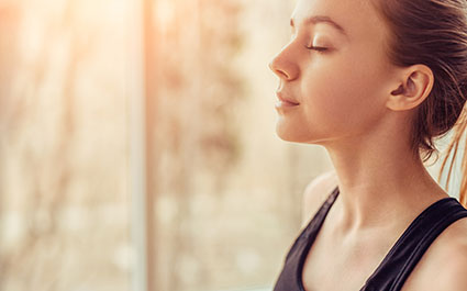 Relaxed woman focused on her breathing