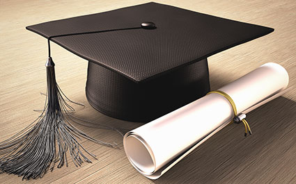 Graduation cap and a piece of paper rolled up