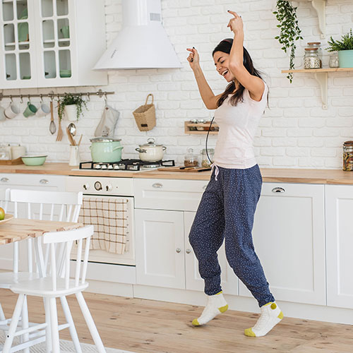 Woman dancing in the kitchen