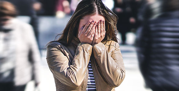 Woman having an anxiety attack in public