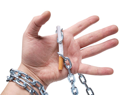 Hand with a cigarette chained onto the palm
