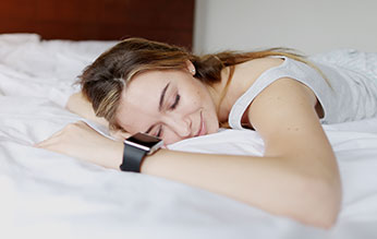 Woman sleeping soundly in bed